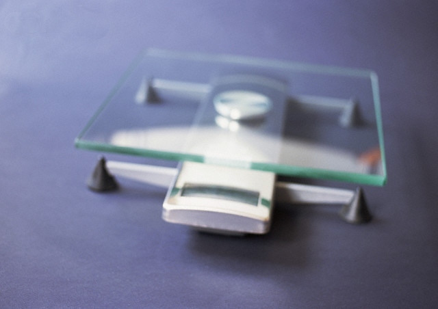 Bathroom Scale, Close-up, Blurred --- Image by © Michele Constantini/PhotoAlto/Corbis