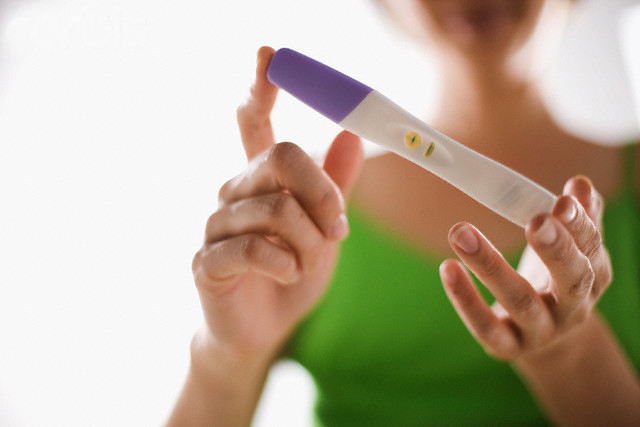 Woman Taking Pregnancy Test --- Image by © Randy Faris/Corbis